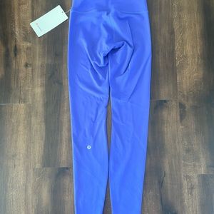 Lululemon Wonder Train HR Tight 28” Purple Leggings. Never worn, size 4.